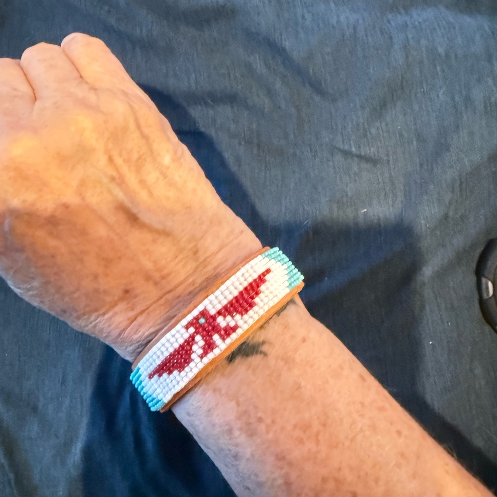 Beaded Bracelet on leather cuff with Red and White Thunderbird.